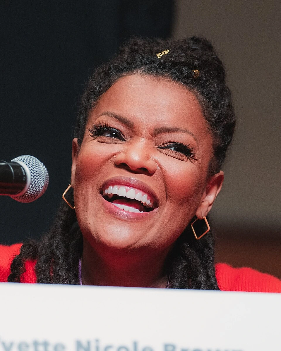 Yvette Nicole Brown speaking at a microphone